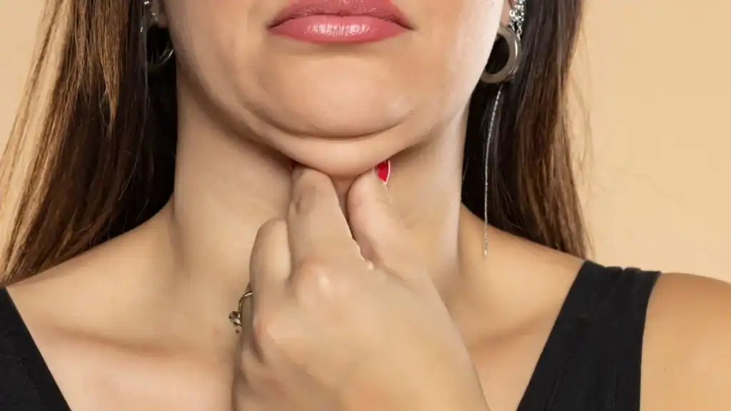 An image of a woman with double chin, sad, worried : Non Surgical Double Chin Removal Treatment in Portsmouth, UK